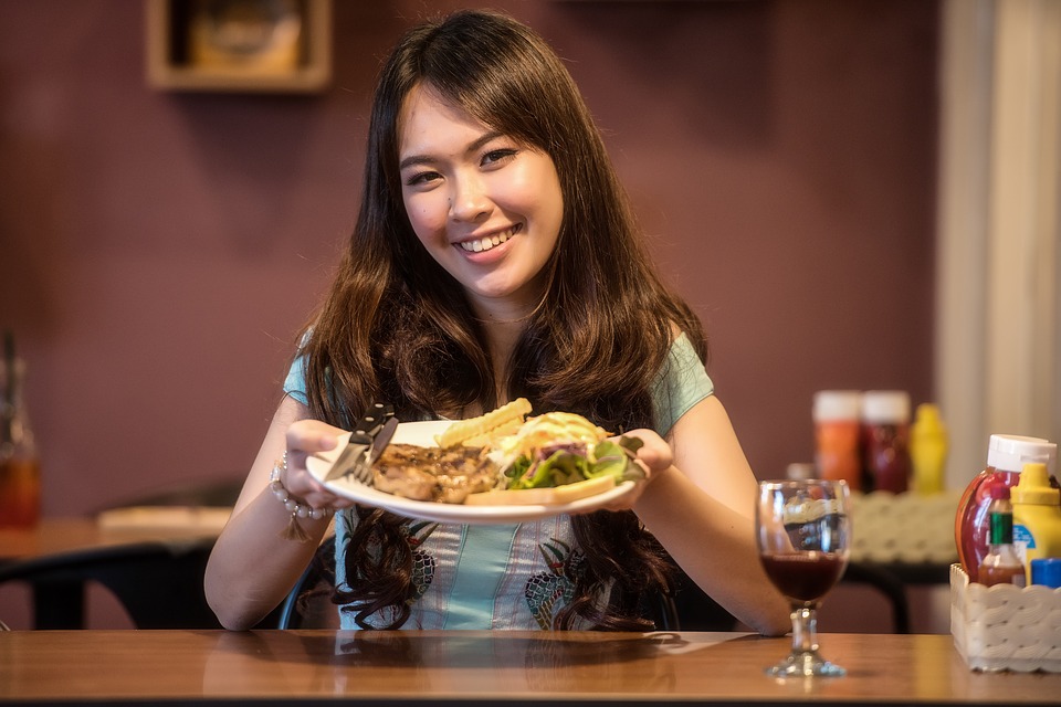 Woman cooking steak